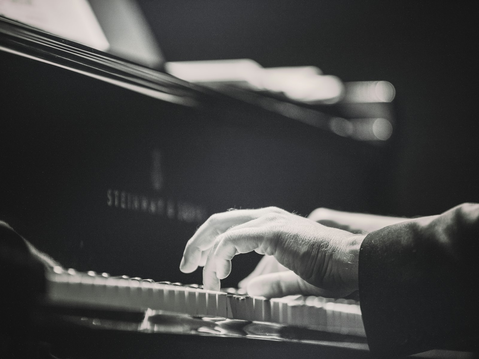 Hands playing piano